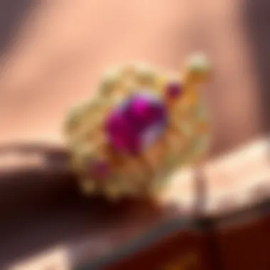 An antique piece of jewelry featuring a stunning ruby set in intricate gold.