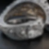 Close-up view of a pave cathedral engagement ring showcasing intricate diamond setting