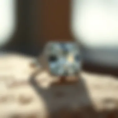 An elegant cushion cut ring featuring an intricate band design