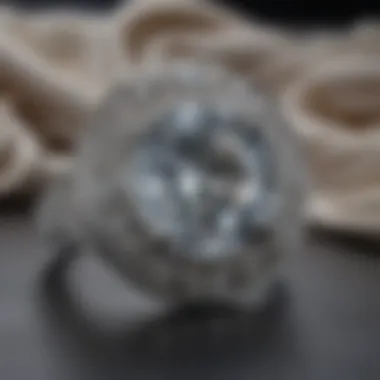 Close-up of platinum jewelry against a soft fabric background