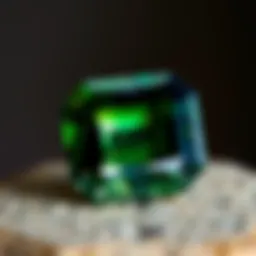 A close-up view of a beautifully cut tsavorite garnet showcasing its vibrant green hues