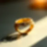 A close-up view of a gold ring with intricate detailing reflecting light.