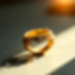 A close-up view of a gold ring with intricate detailing reflecting light.