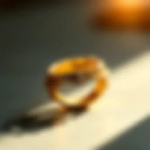 A close-up view of a gold ring with intricate detailing reflecting light.