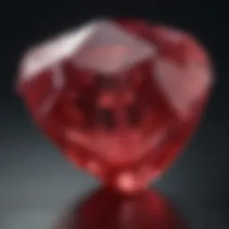 Close-up view of a raw ruby gemstone displaying its natural facets