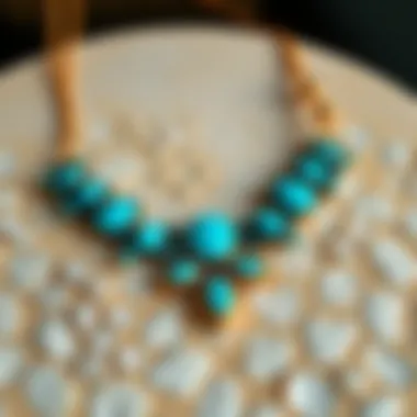 An elegant turquoise necklace displayed on a textured surface, highlighting its unique design and craftsmanship.