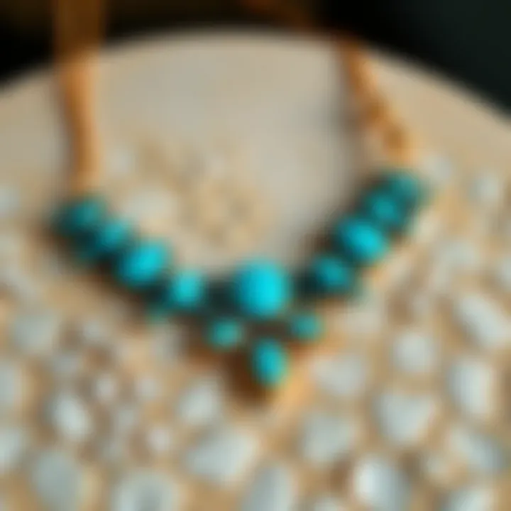 An elegant turquoise necklace displayed on a textured surface, highlighting its unique design and craftsmanship.
