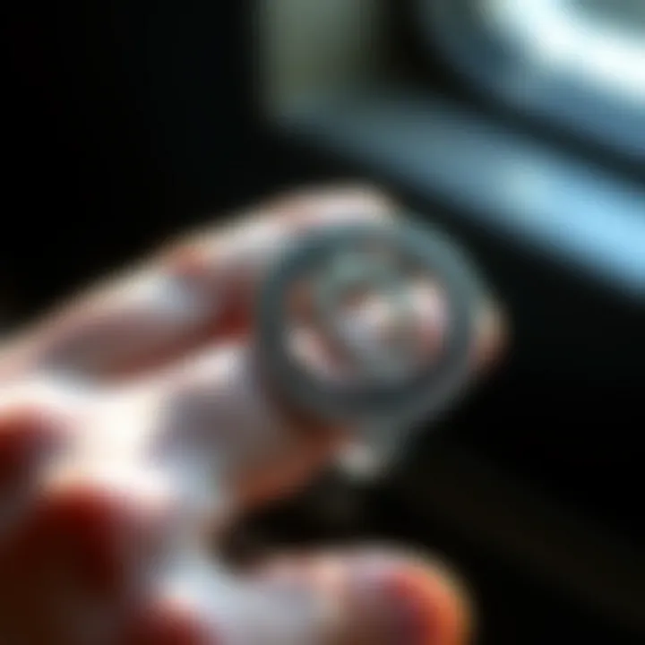 User employing a flat ring sizer to determine accurate ring size